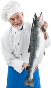 chef-holding-a-fresh-salmon-176x300