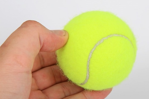 Exercising with a tennis ball may help relieve sciatic nerve pain caused by muscle tension.